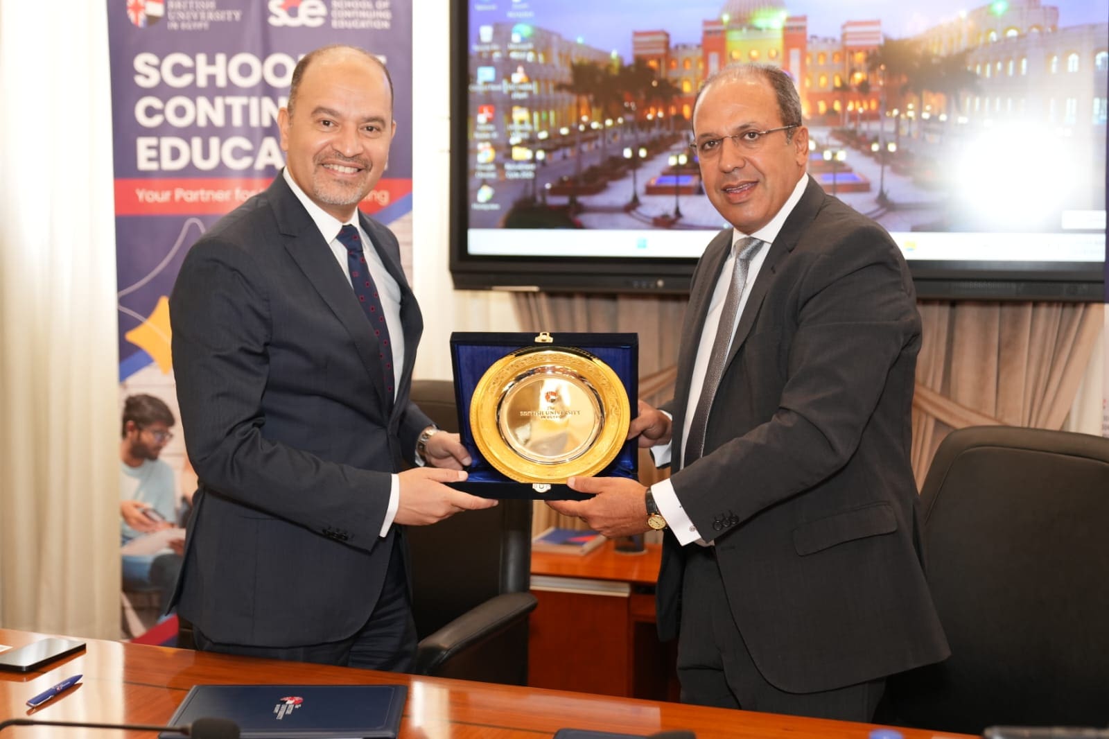 IMG 20250603 WA0102 الجامعة الجامعة البريطانية في مصر توقع بروتوكول تعاون مع المعهد المصرفي المصري موقع في الجامعة