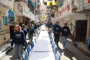 IMG 20260305 WA0097 جامعة بدر بروح التطوع.. طلاب جامعة بدر يشاركون في إفطار المطرية الجماعي موقع في الجامعة